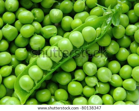 Fresh young peas background macro