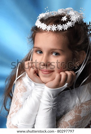 First Communion beautiful girl in white dress