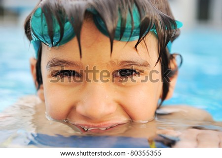 Summertime and swimming activities for happy children on the pool