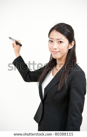 asian businesswoman writing by marker