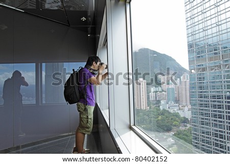 photographer takes a photo of the landscape indoor