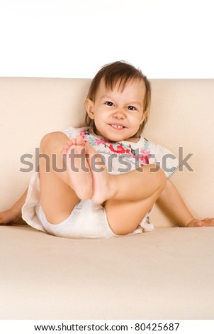 portrait of a funny baby at sofa
