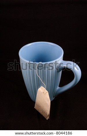 A pretty picture of a blue teacup with tea bag