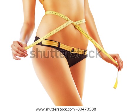 slimming woman body in panties with measure on white background