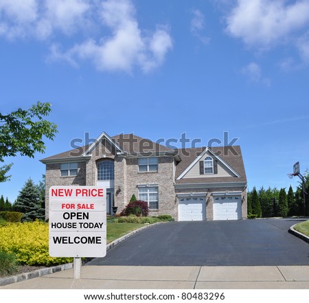 Realtors Open House Realty Sign at Driveway end of Suburban Luxury McMansion Home