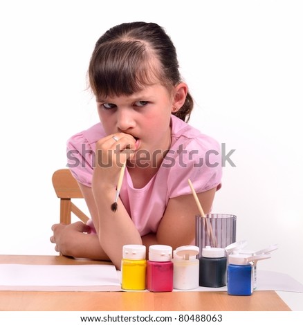 Sad girl waiting for inspiration wishing to paint a picture isolated on white background