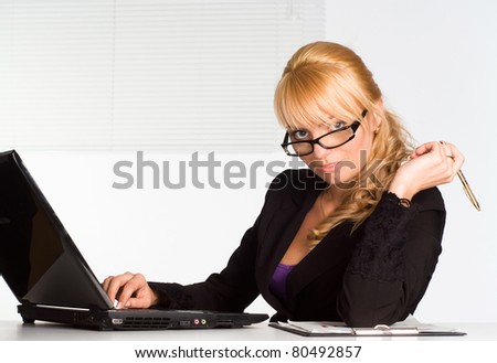 very cute girl working with laptop at table