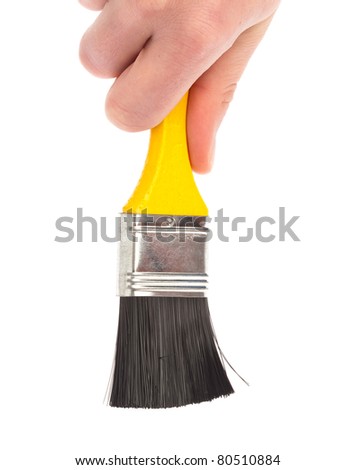 hand holding a paintbrush on a white background