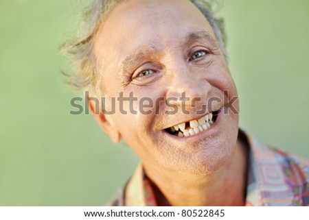 portrait of senior caucasian man with dental problems showing missing tooth and smiling. Horizontal shape, copy space Royalty-Free Stock Photo #80522845
