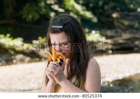 picture of a young girl near a stream