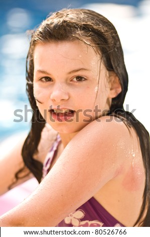 picture of a young girl playing in a pool