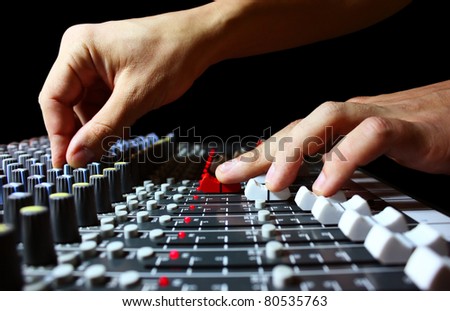 Hand on a mixer, operating the leader Royalty-Free Stock Photo #80535763