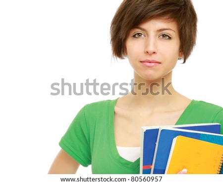 A young brunette woman (student) with books looking up