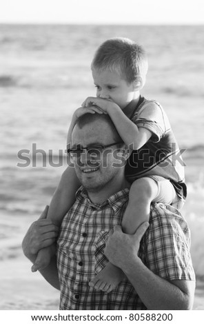 child with his father at sea
