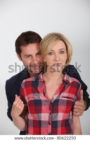 Man and wife stood together in studio