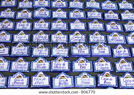 Rows of blue and white house name plaques at Spanish market
