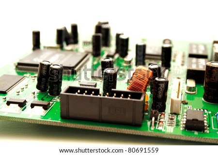 Zoomed foto of green computer circuit board transistors