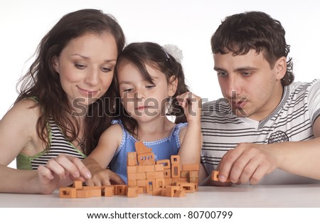 portrait of a nice family playing on white