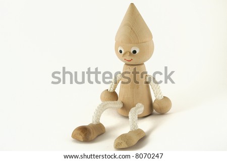 Pinokio wooden figure. Isolated toy on the white background.