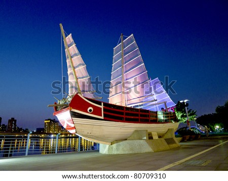 a taiwan ancient ship shows in a public place in night