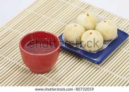 Chinese tea in red cup with