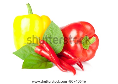 Red chili pepper with leaves and sweet paprika on white background