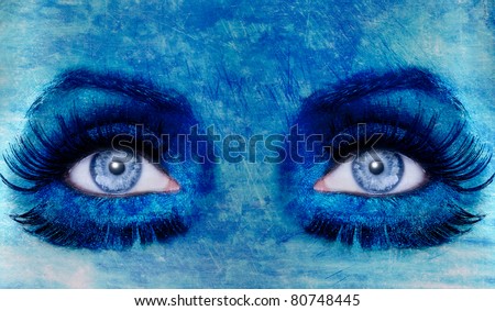 abstract blue woman eyes makeup with a grunge painted wall texture [Photo Illustration]
