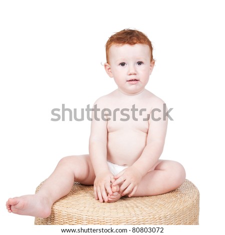 Picture of sitting baby boy in diaper over white
