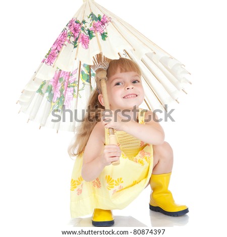 Picture of beautiful little girl in yellow boots with umbrella over white