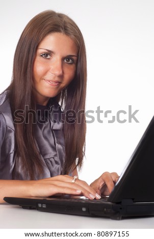 cute girl with a laptop on white