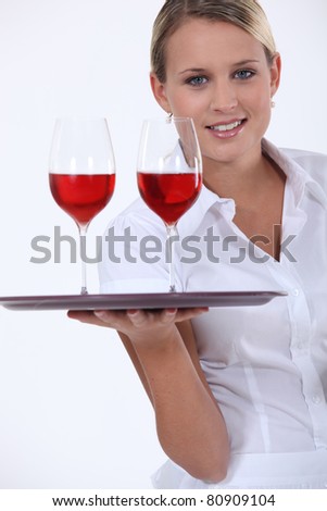 Sommelier with two glasses of red wine