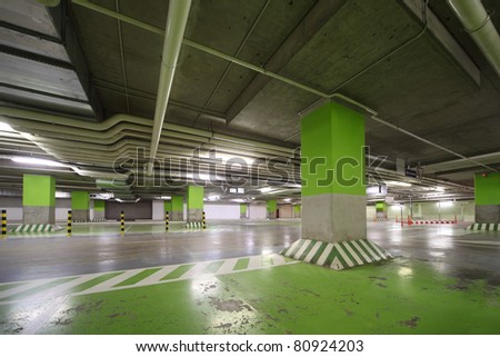 Parking garage of shopping center, underground interior without cars