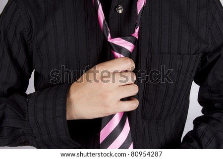 set necktie, male model setting necktie arrange to go work.