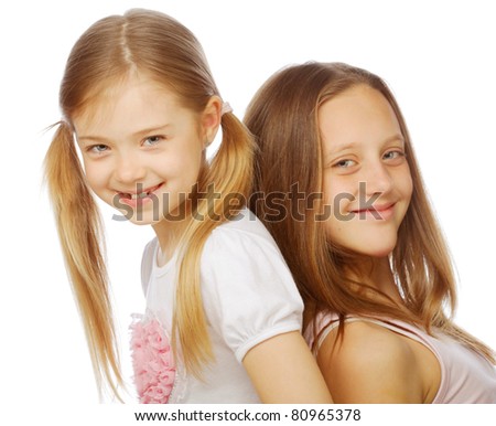 two beautiful little girls on a white background