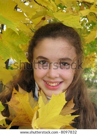 Smile girl with yellow leaves