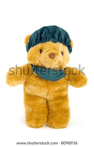 Children's toy. A bear - the doctor in a green bandage and a cap