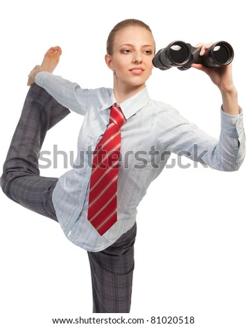 Business woman standing in flexible pose and looking in binocular researching field