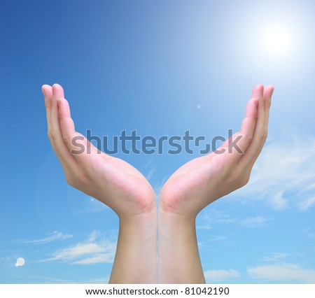 hand holding isolated on blue sky