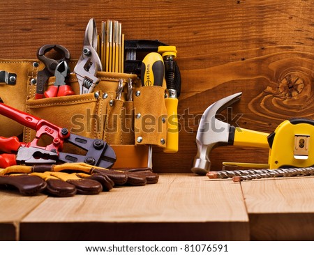 set of working tools on board background Royalty-Free Stock Photo #81076591