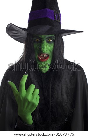 Green witch beckoning you over, white background.