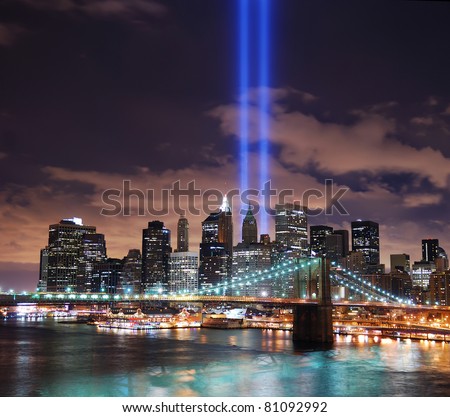 NEW YORK CITY, NY - SEP 11: City night view with light beam on September 11, 2010 in Manhattan, New York City. Light beams are lit at the site in memory of World Trade Center.