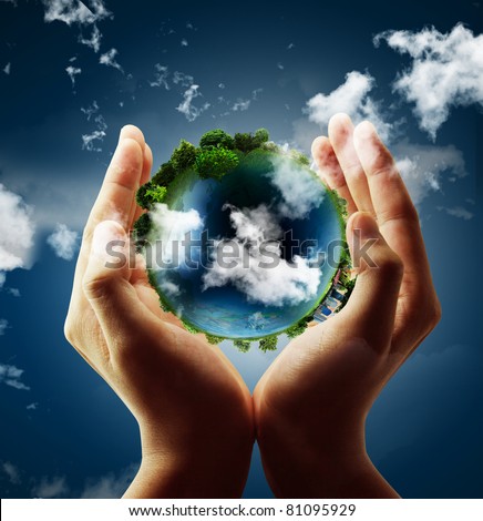 holding a glowing earth globe in his hands Royalty-Free Stock Photo #81095929