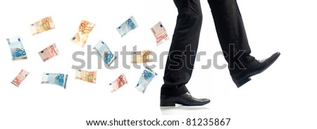 Business man walking, bank note following