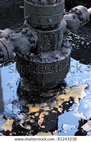 Spilled crude oil around oil field. Oil and Gas Industry.
Environmental pollution. 