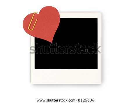 Red paper valentine heart attached to a blank instant picture photo print 