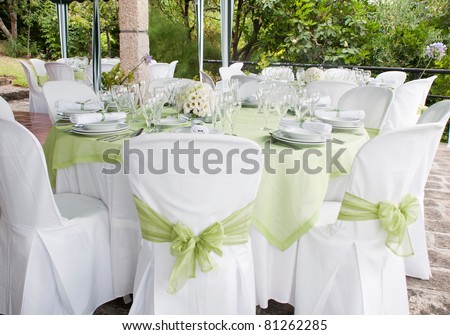 gorgeous wedding chair and table setting for fine dining at outdoors Royalty-Free Stock Photo #81262285
