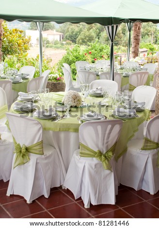 gorgeous wedding chair and table setting for fine dining at outdoors Royalty-Free Stock Photo #81281446