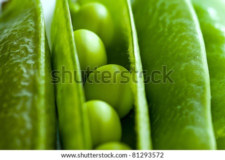 fresh green peas isolated on white Royalty-Free Stock Photo #81293572