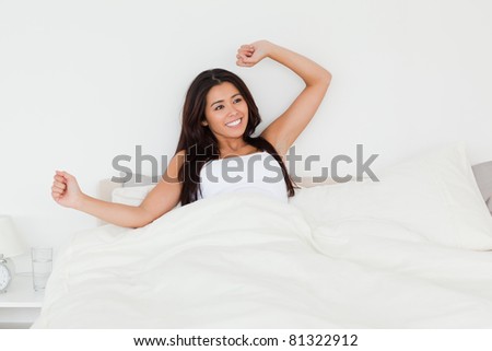 waking woman in bed in bedroom