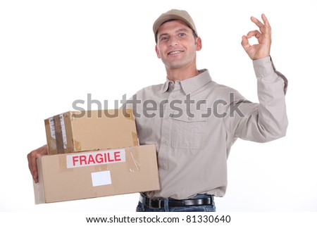 delivery man holding packages and doing the okay sign